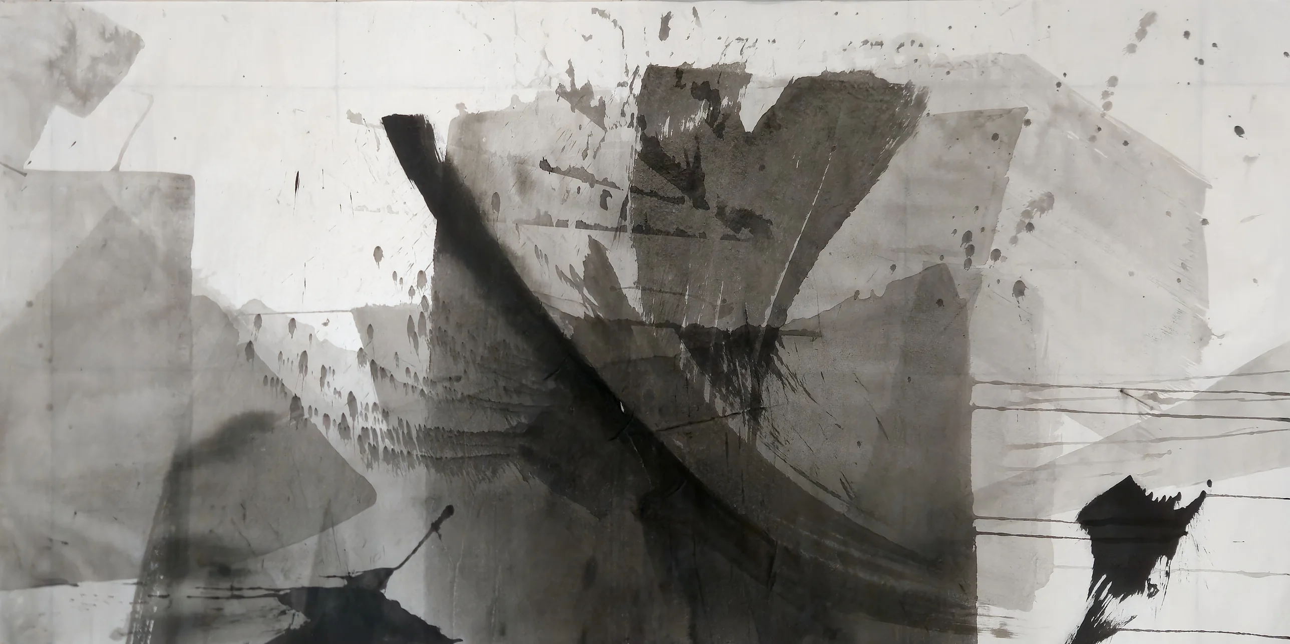 A black diagonal arc crosses a large grey central block among pale grey planes, with spatter above and black blots lower left and right.