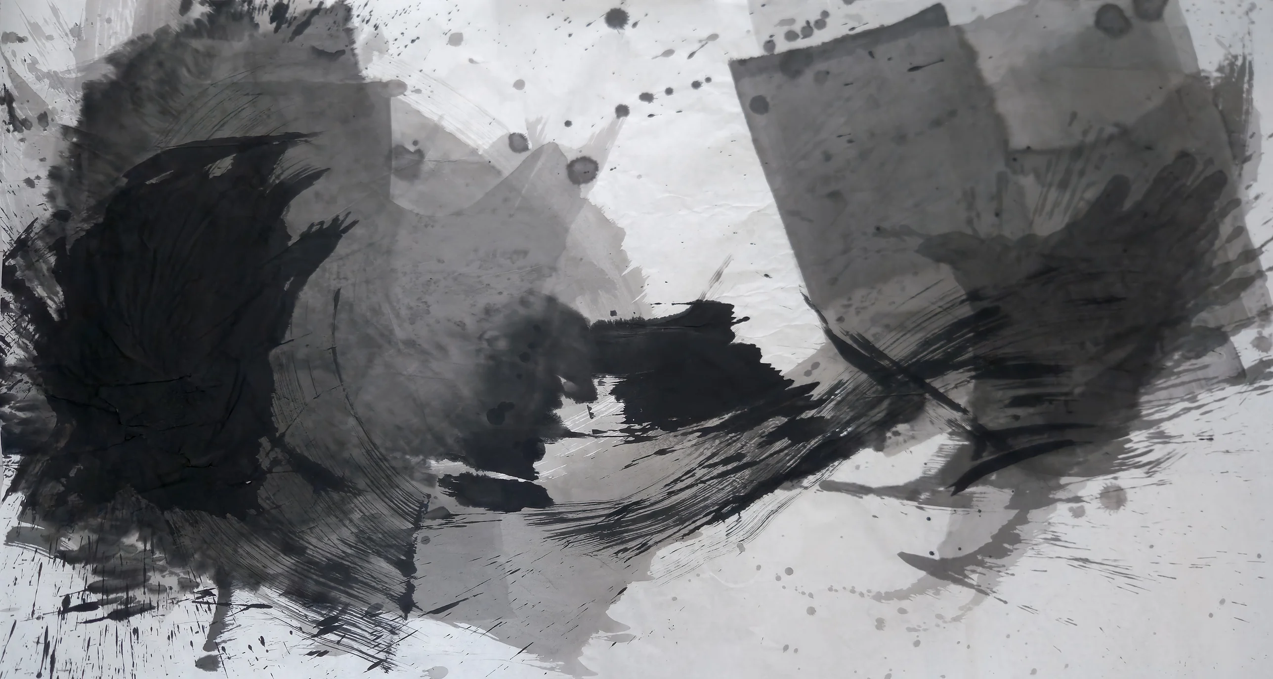 Wide ink painting: dense black mass at left, grey hand-like shape and pale rectangles at right, joined by a low dry-brush arc, drips above.