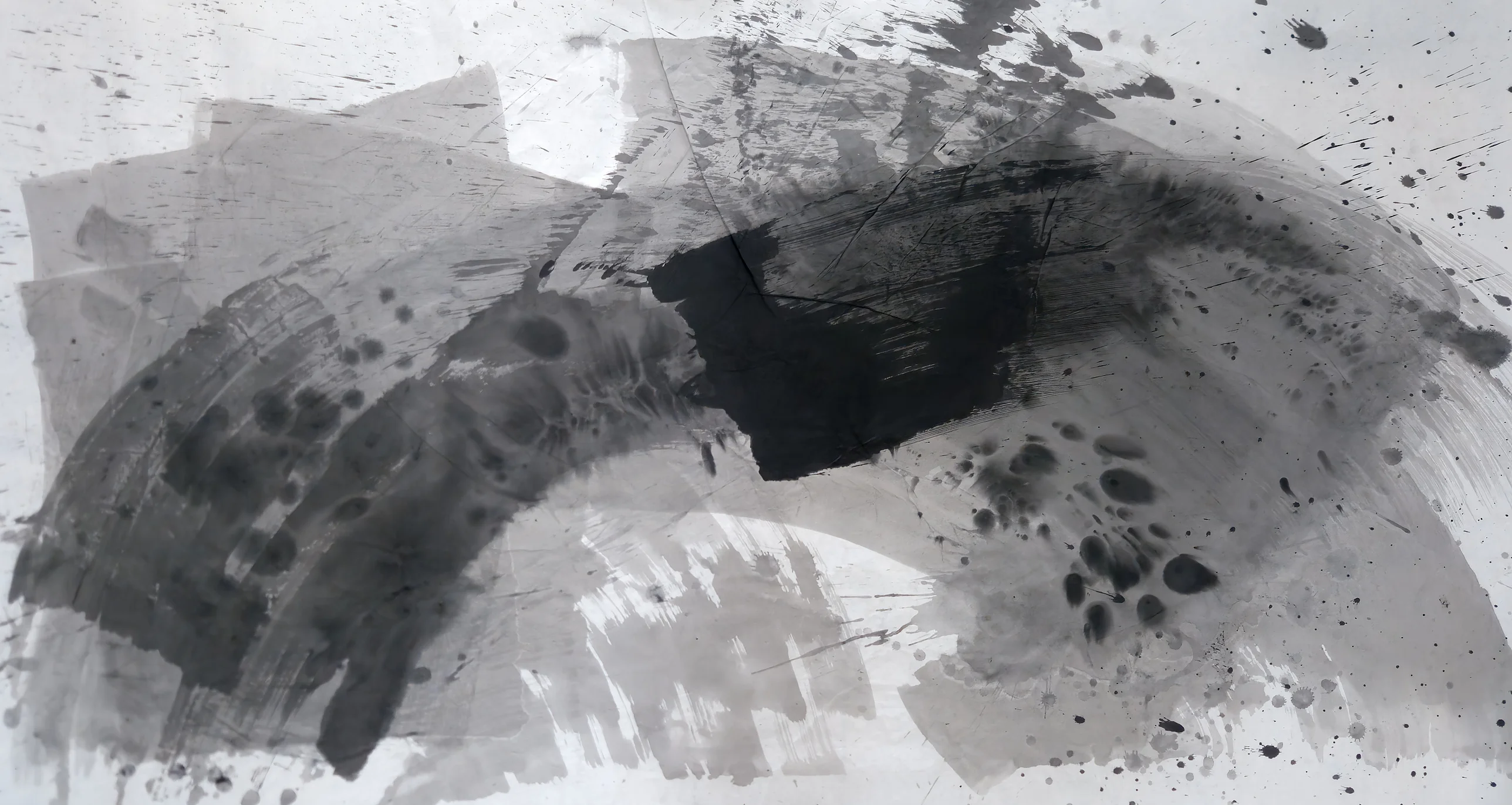 A wide grey brushed arc over white space, a dense black rectangle at centre, and black spatter scattered across pale paper.