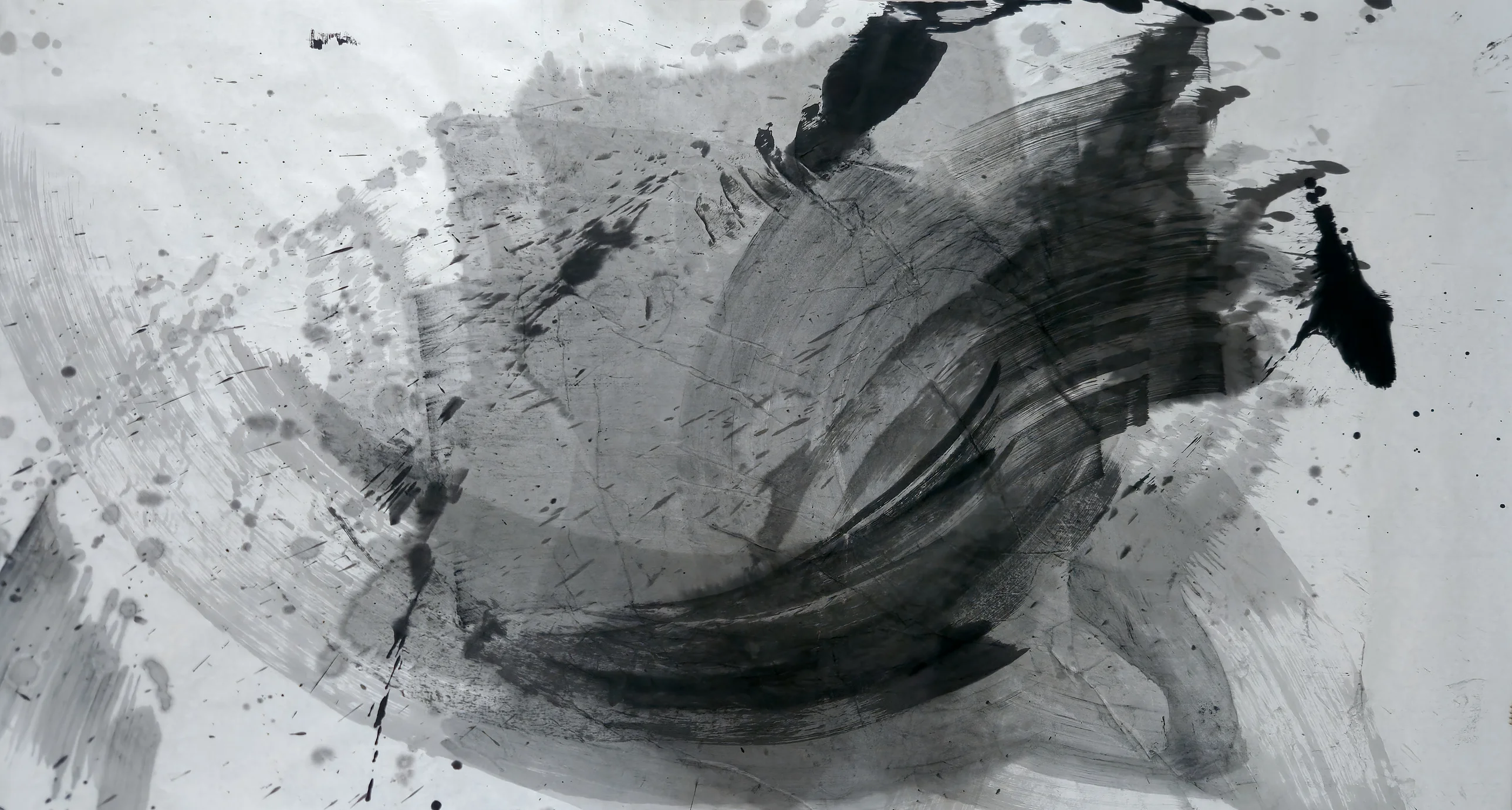 Pale paper with a large circular sweep of grey and black brushstrokes, a dark curved crescent lower centre, black blots top and right, spatter upper left.