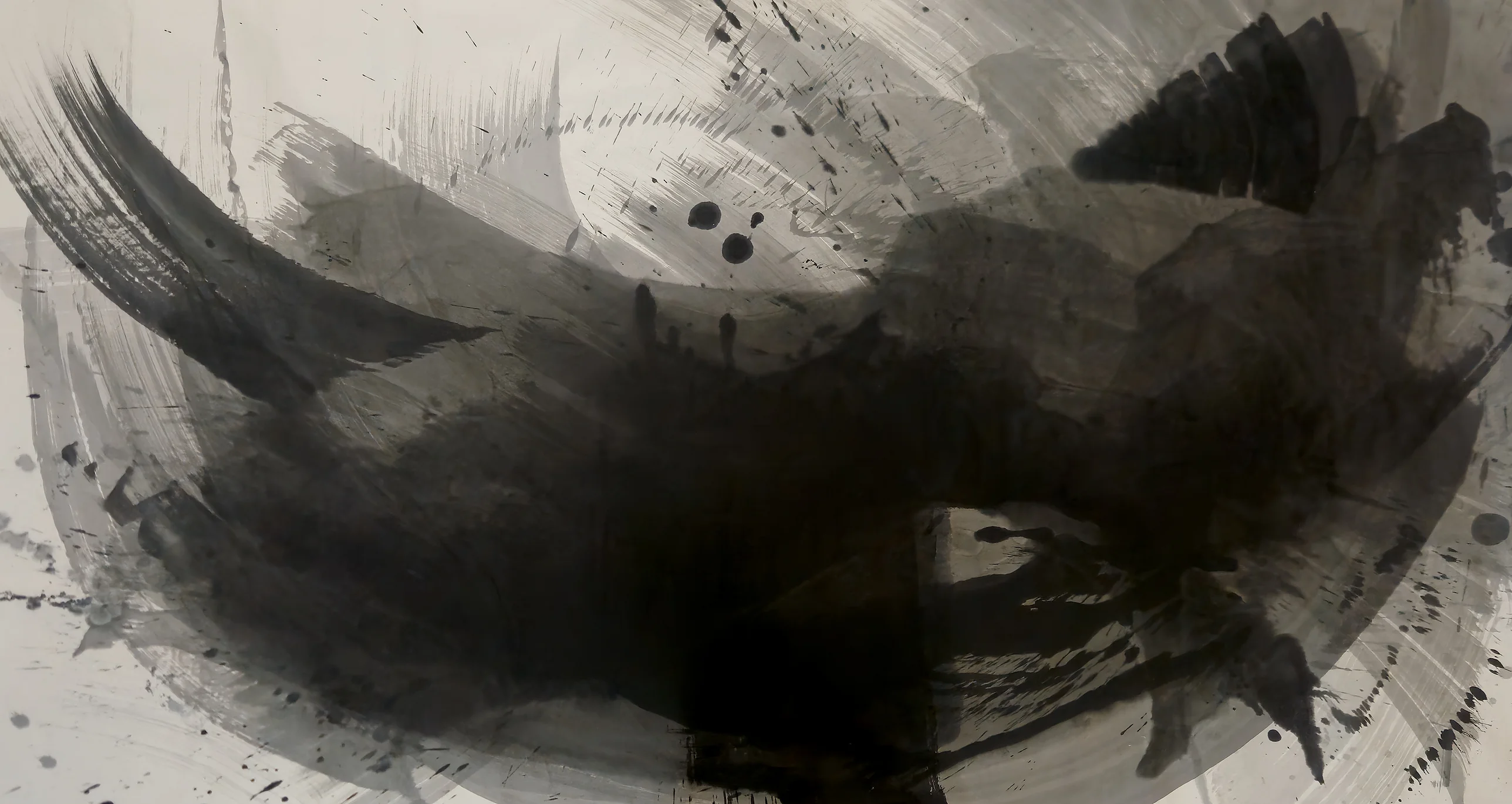 Wide ink painting: a dark bowl-shaped sweep of black and grey across pale paper, with a dry arc upper left and a black fan upper right.