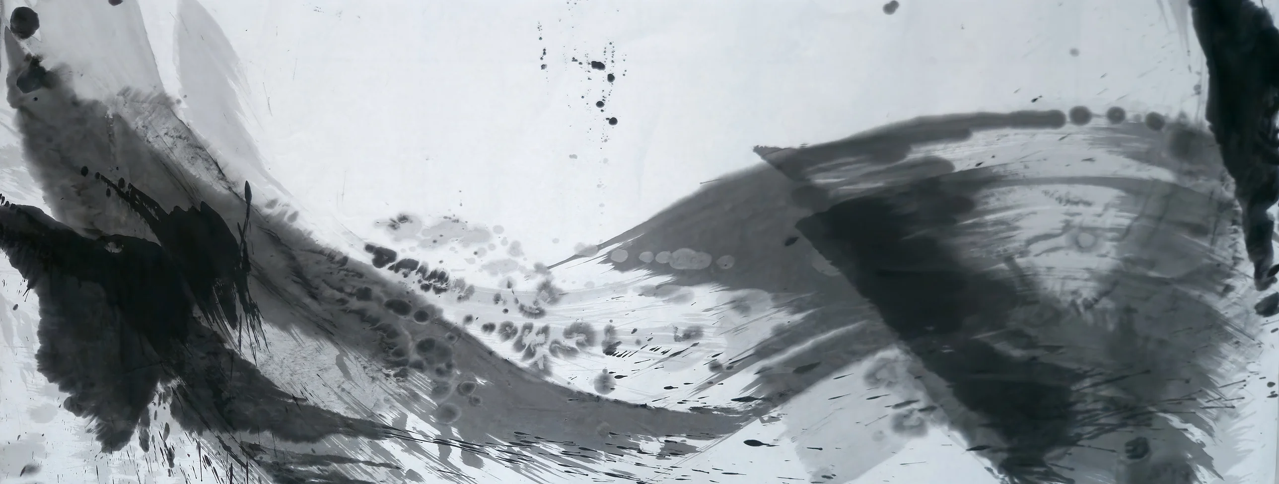 A grey ink wave sags across pale paper from a dark blotched mass at left to a dark diagonal band and black strip at right.