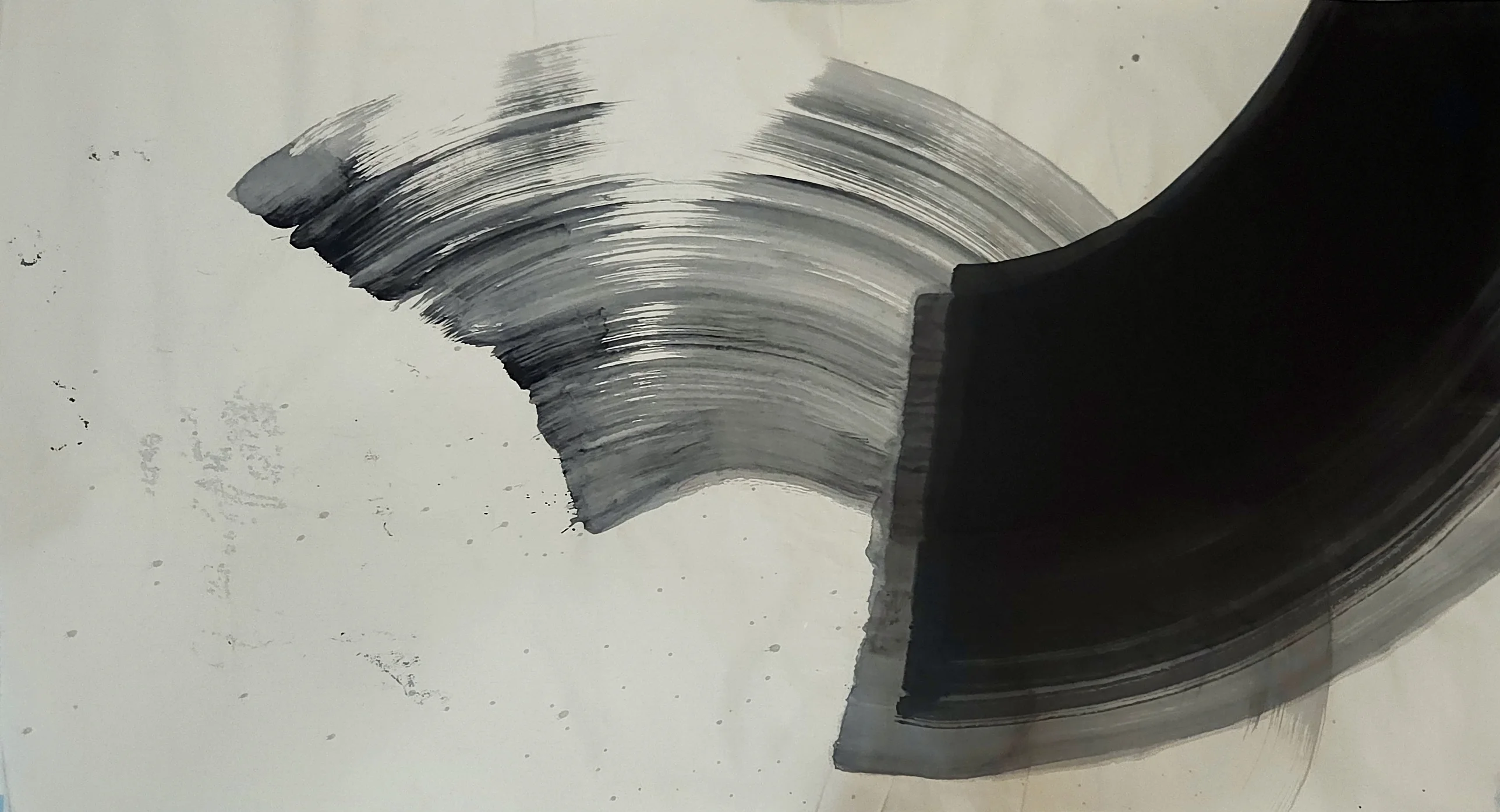 A large black arc fills the right side, running off the top and right edges, with a streaked grey arc sweeping toward it from the left.