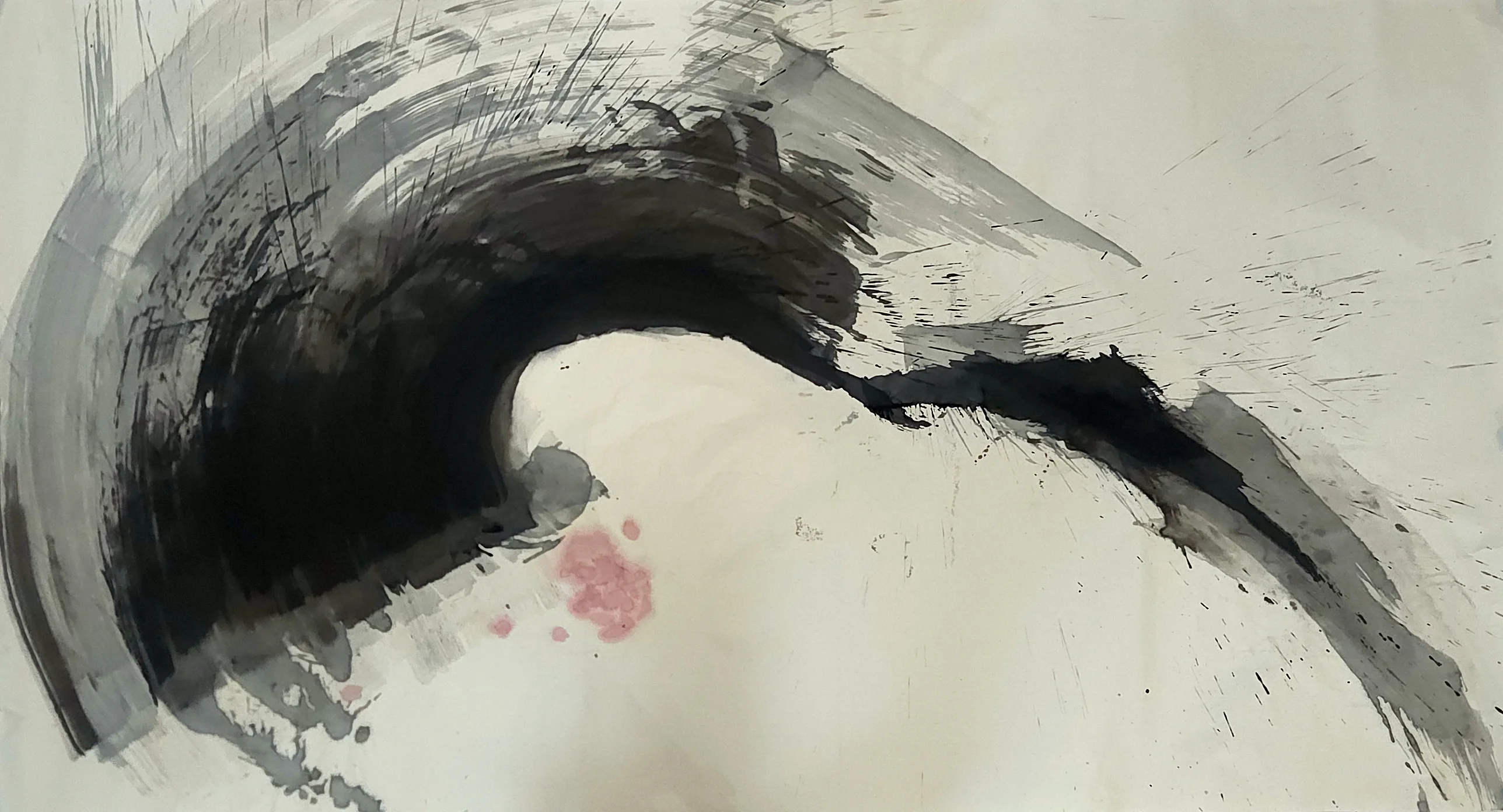 A thick black arc curves from left over the top to a tapering lower-right tail, with grey streaks, spatter and a pink cluster below.