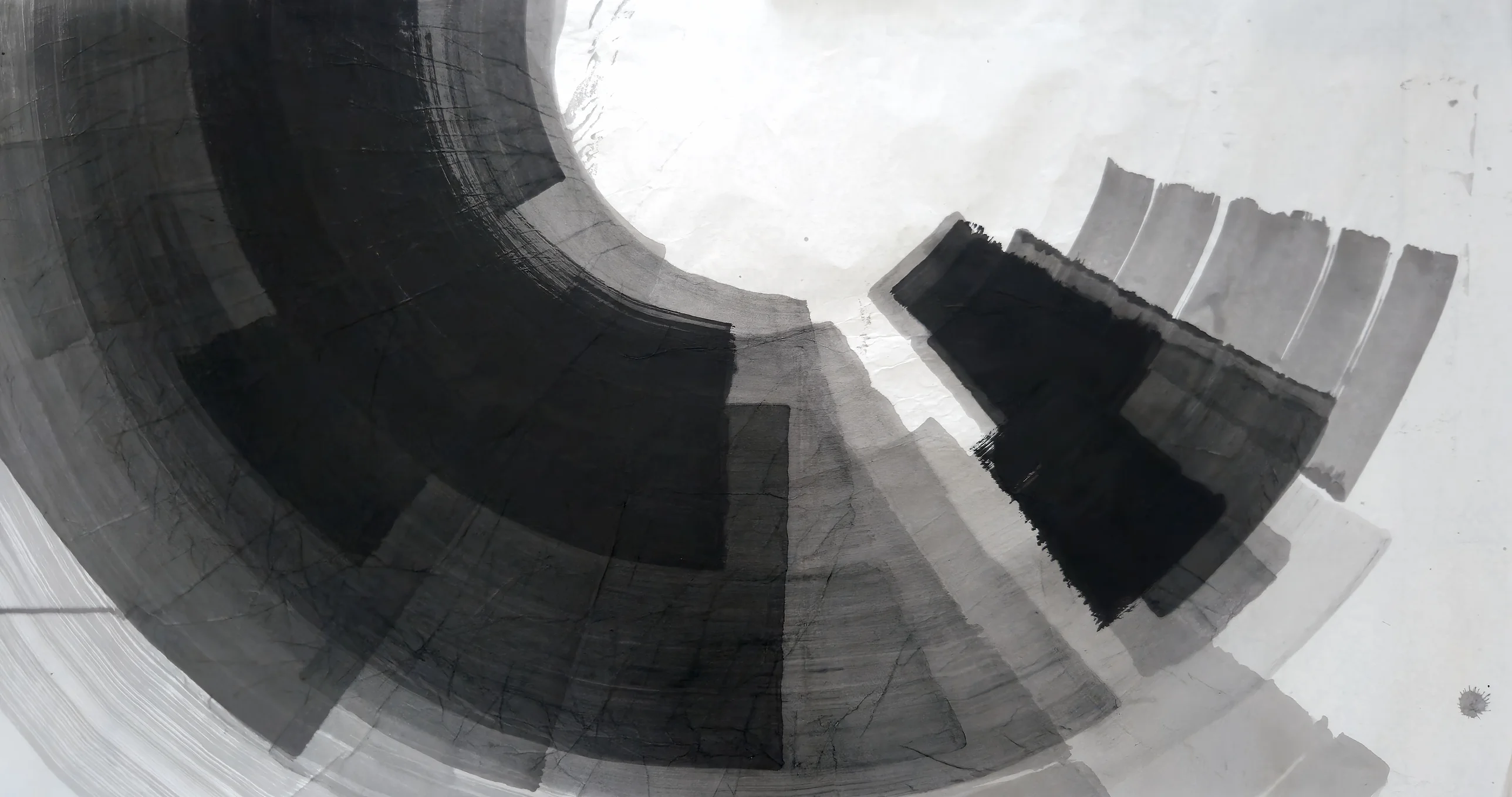 A large dark arc of black and grey bands curves around a white circle at upper centre, with stepped black and grey blocks at right.