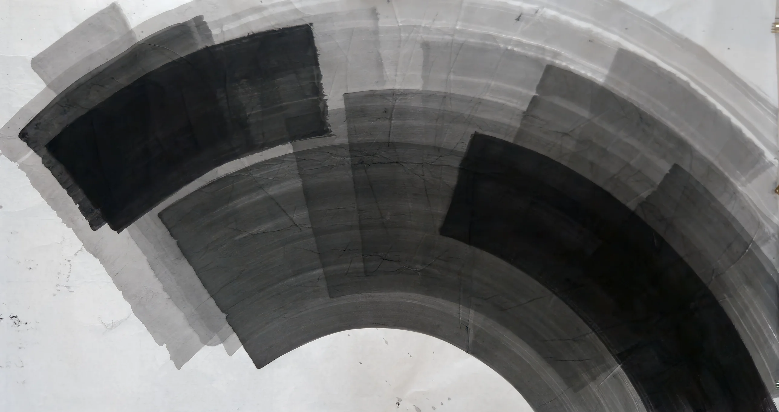 Black and grey curved ink bands form a wide arc from upper left to lower right around a half circle of white paper.
