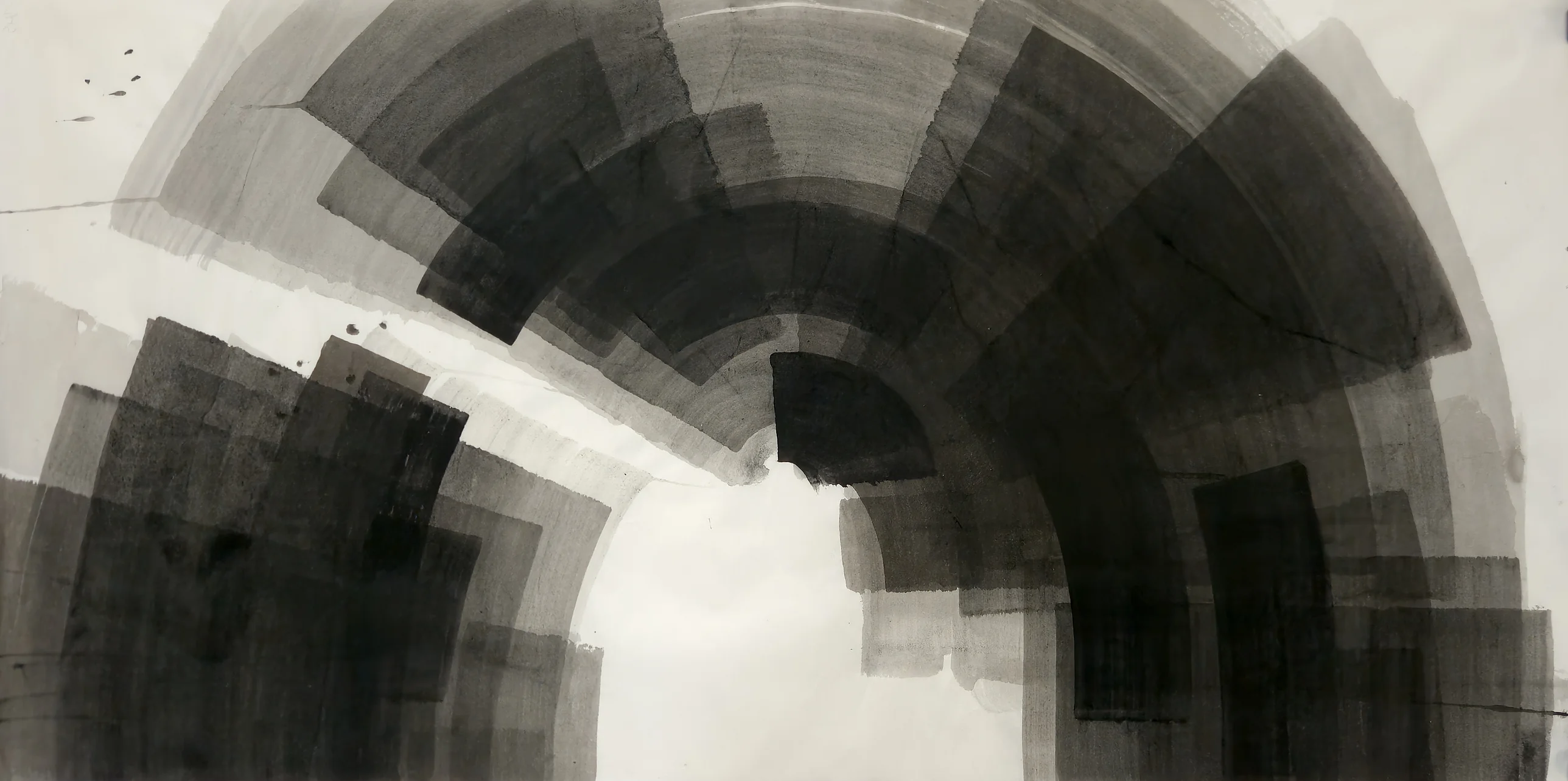 A large arch of overlapping grey and black curved bands over a white opening, with dark stacked rectangles at lower left.