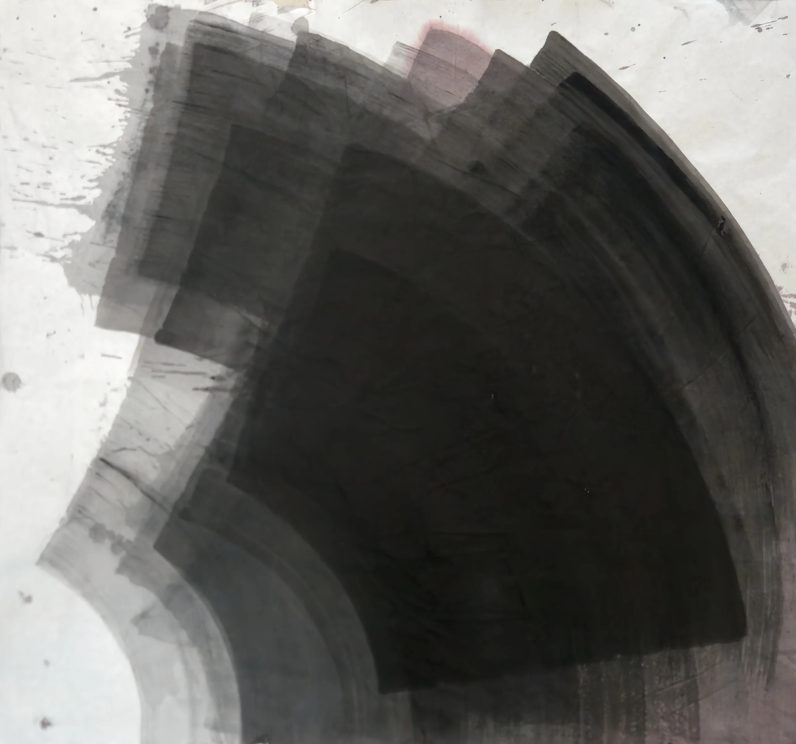 A huge black quarter-circle fan ringed by translucent grey bands rises from the lower left, with spattered white paper along the left side.