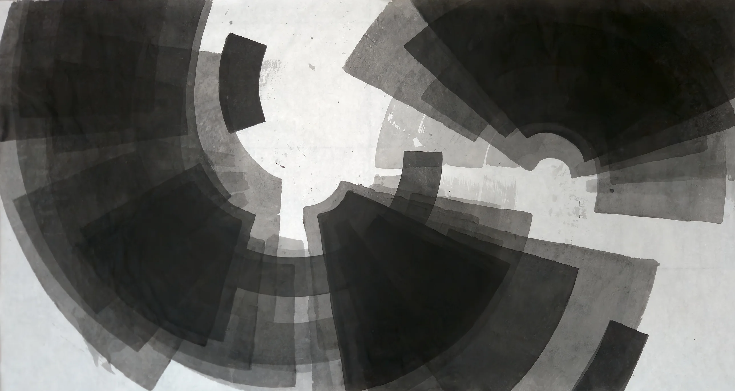 Wide sheet of overlapping grey and black arc bands and fan wedges circling an irregular white centre, a small black block at lower right.