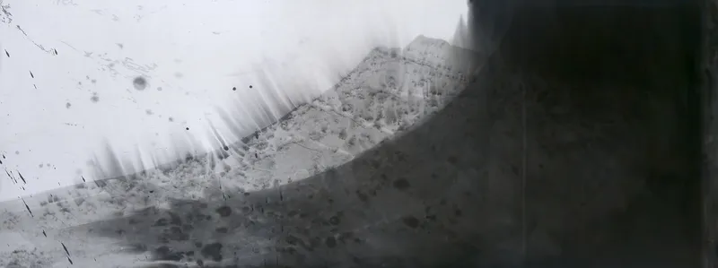 T_146: Grey arc rising from lower left to upper right with a feathered top edge, bare paper upper left, solid black block filling the right.