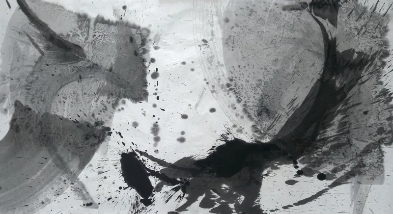 T_219: Wide ink painting: grey wash slabs and a pale ring at left, a dark curving stroke rising right, black blots and spatter below centre.