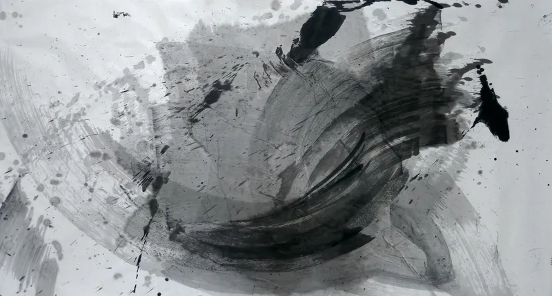 T_227: Pale paper with a large circular sweep of grey and black brushstrokes, a dark curved crescent lower centre, black blots top and right, spatter upper left.