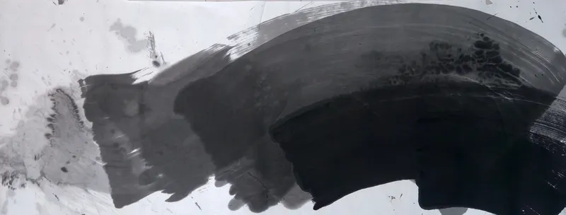 T_252: A wide ink arc sweeps from pale grey at left to dense black at lower right, rising toward the upper right, with stains at top left.
