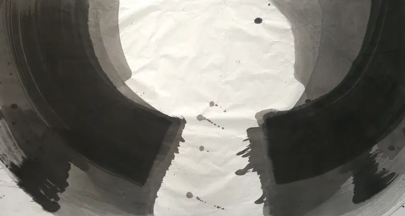 T_288: Two broad black and grey arcs curve toward each other across a wide sheet, framing a white circle with scattered ink drops below centre.