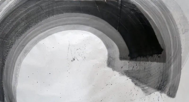T_326: A wide grey arc sweeps from lower left over the top into a squared black mass at upper right, enclosing pale paper, with spatter lower right.