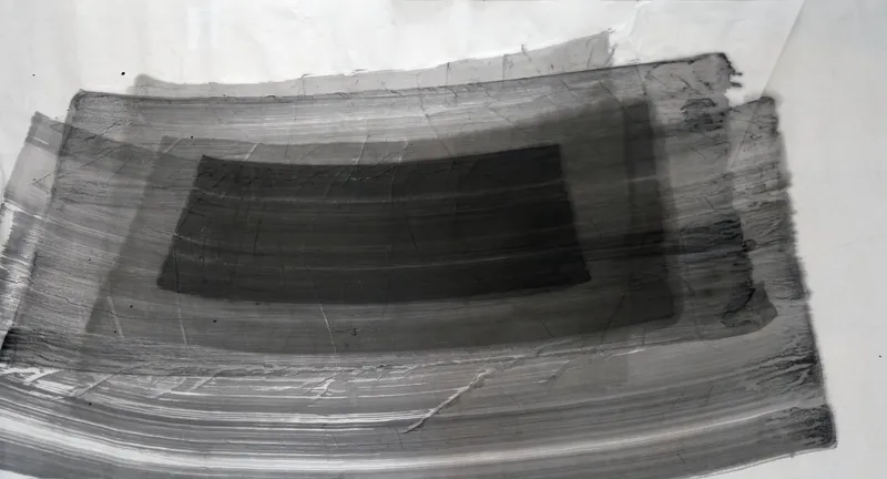 T_327: Wide horizontal grey brush bands, nested and gently bowed, stepping darker toward a dark rectangle at centre, with bare paper along the top.