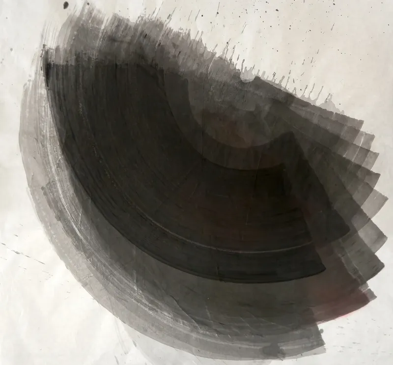 T_372: A large dark grey fan of curved brushstrokes sweeps from upper left to right across pale paper, with drips and spatter toward the upper right.