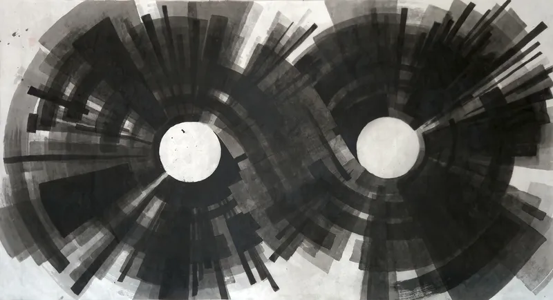 T_400: Two large black radiating wheels of ink, each with a white circular centre, sit side by side on a wide sheet with pale corners.
