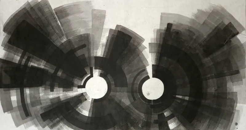 T_403: Two white circles near the centre, each ringed by black arcs and radiating grey and black wedges, filling a wide sheet below a pale top.